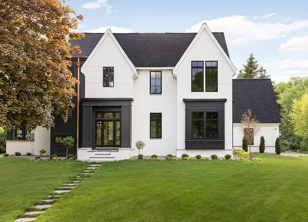 Modern Contrasting Facade: Snow-White Classic with Graphical Black Accents
