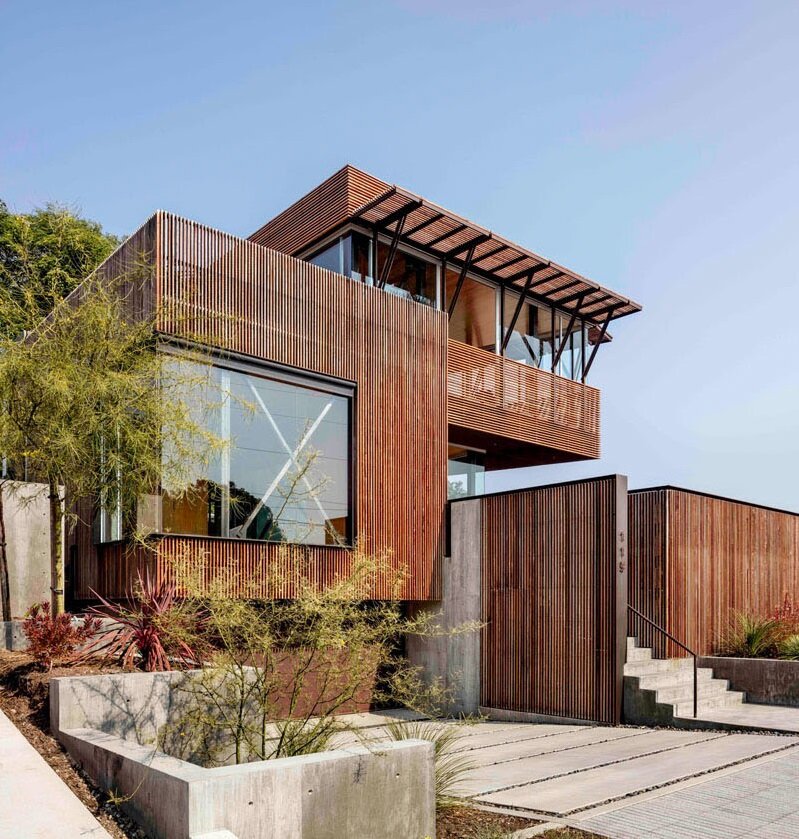 Modern house with wooden slat facade and cantilevered terrace