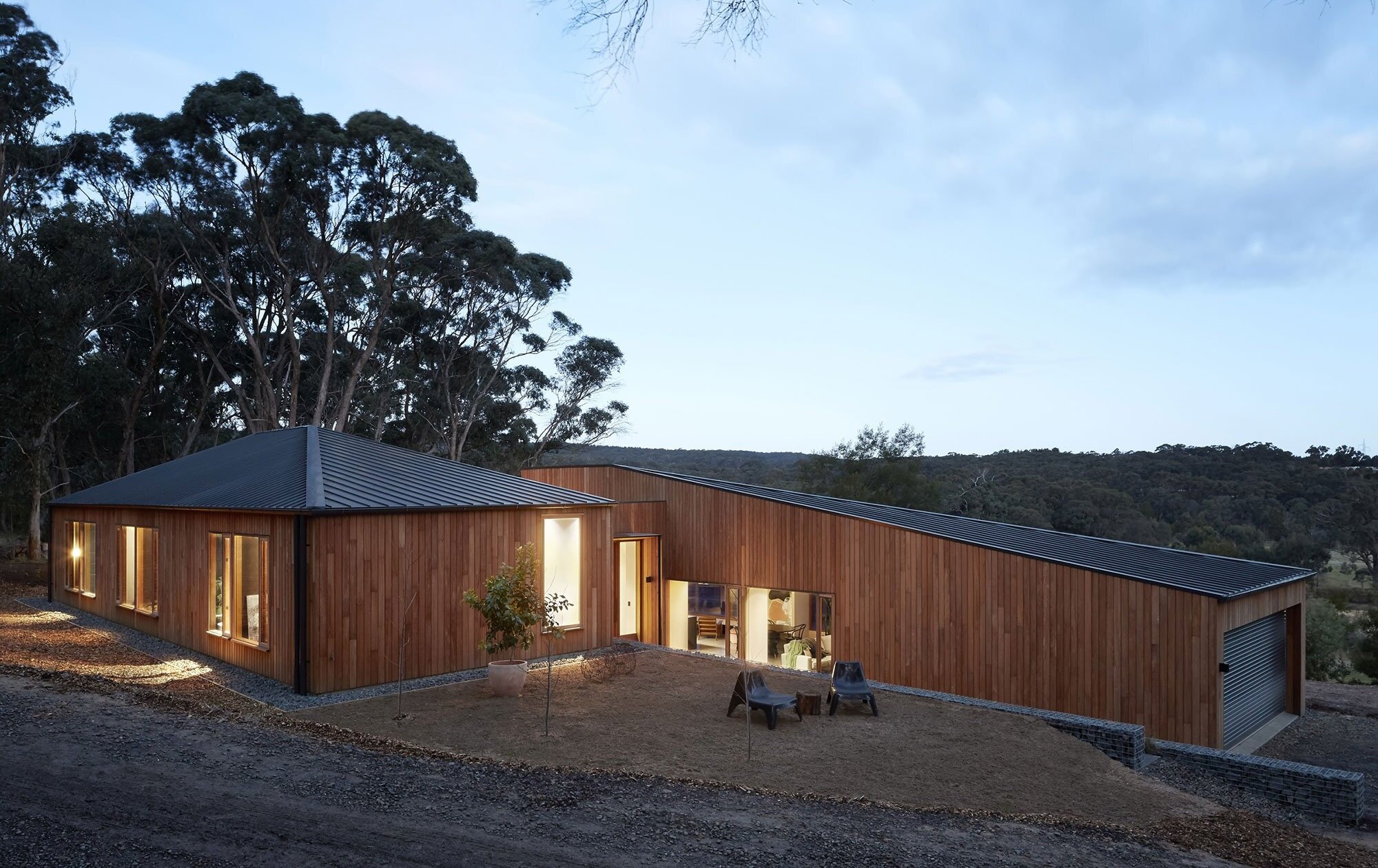 Modern Wooden Facade: Minimalism in Forest Surroundings