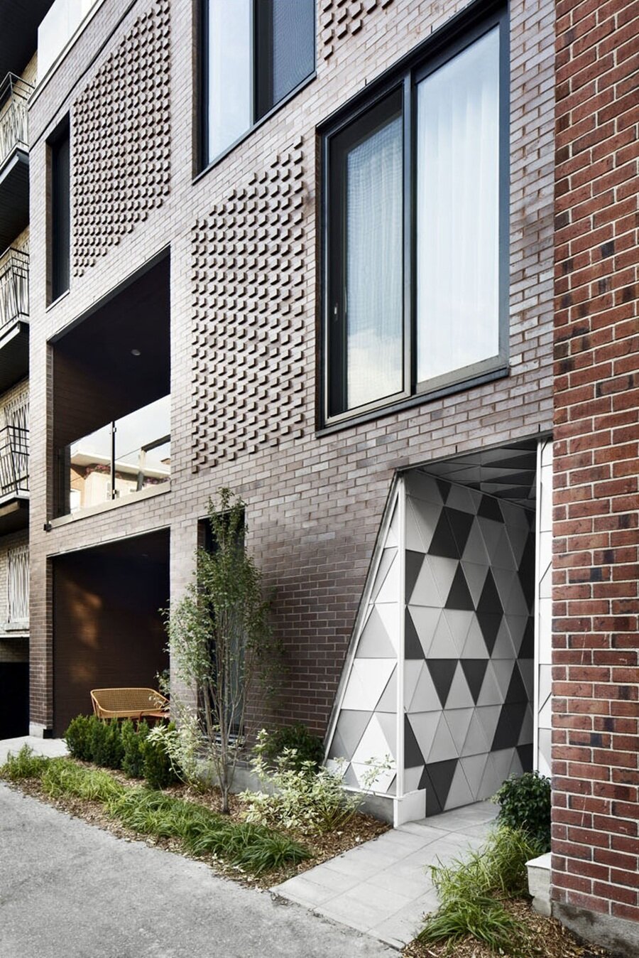 Modern Textured Brick Facade with Geometric Accents