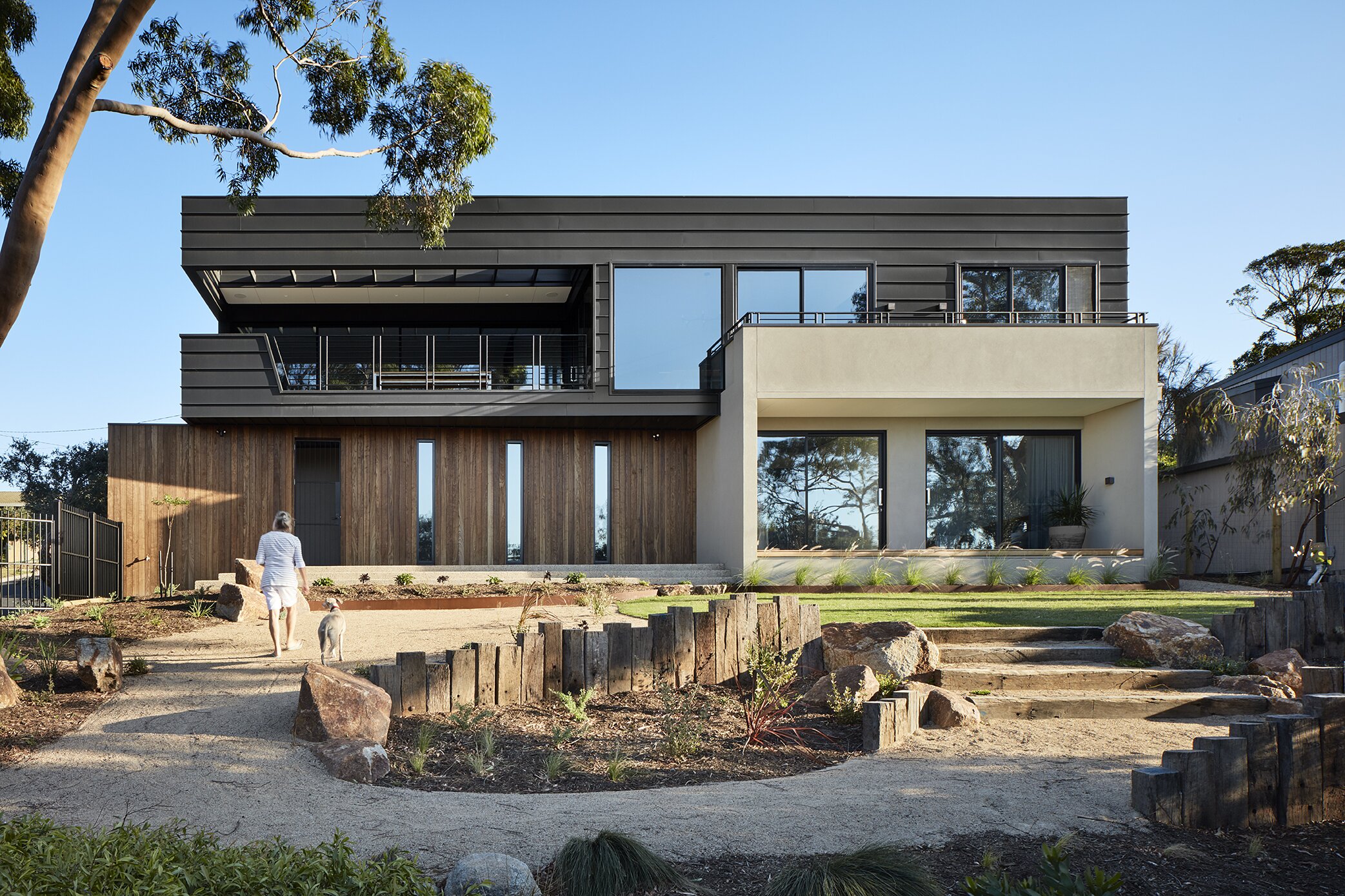 Modern Contrasting Facade with Wood, Concrete, and Metal Combination