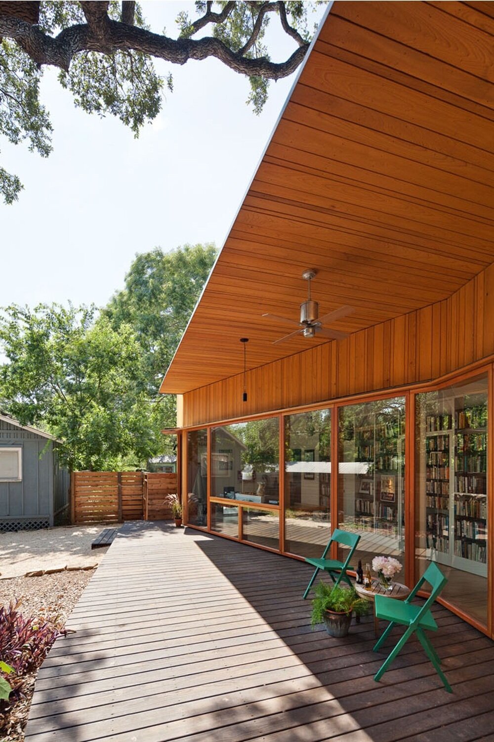 Modern wooden facade with panoramic glazing and functional deck
