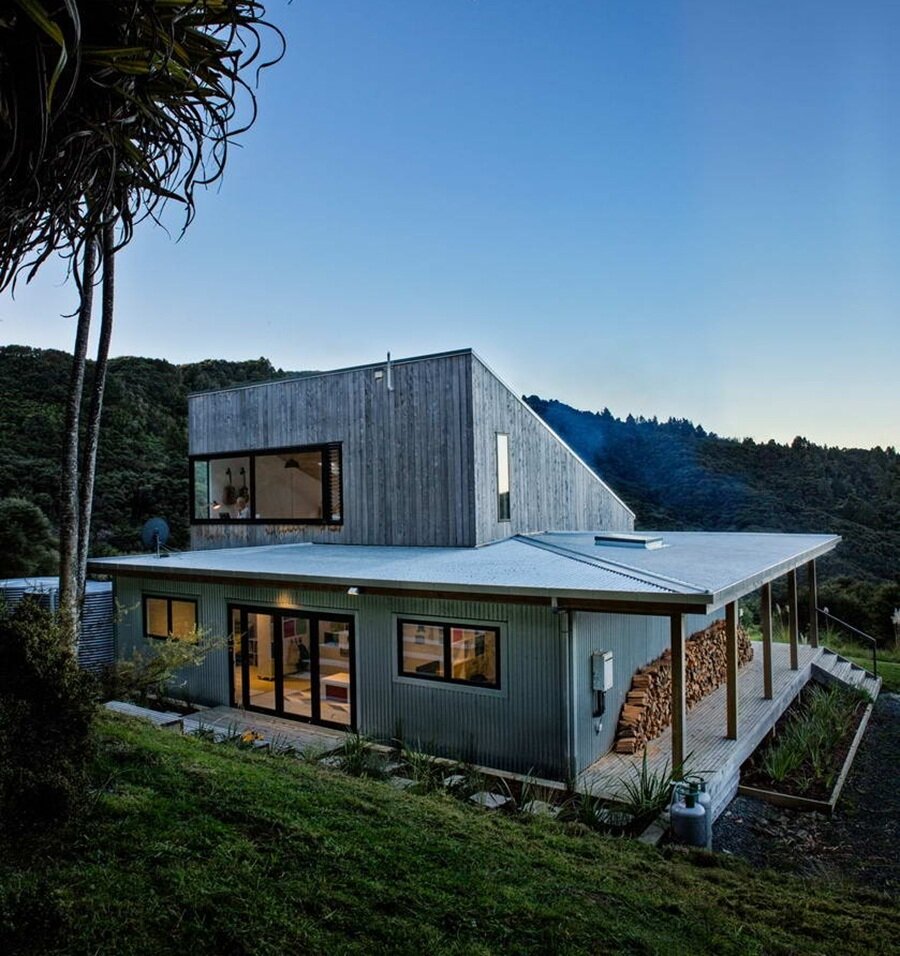 Modern two-level house with combined wood and metal facade