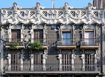 Elegant Catalan Modernist facade with decorative fleur-de-lis elements