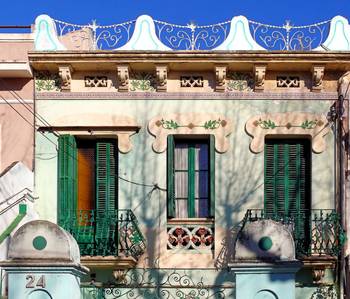 Cladding with shutters on facde