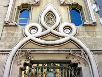 Cladding with fretwork on house facade