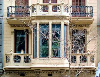 Cladding with oriel windows on house facade