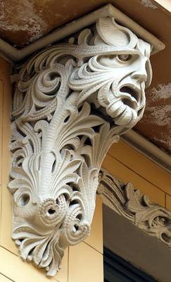 Elegant Baroque Capital: Intricate Craftsmanship on a Historic Building Facade