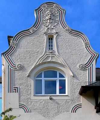 Cladding with Pedimens on house facade