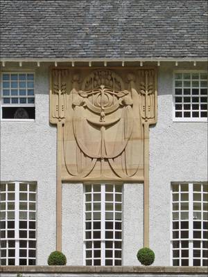 Cladding with fretwork on house facade