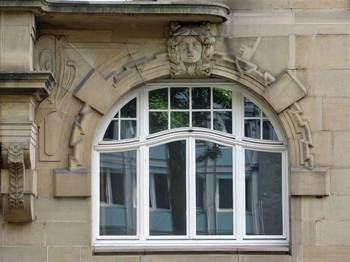 Cladding with windows on house facade
