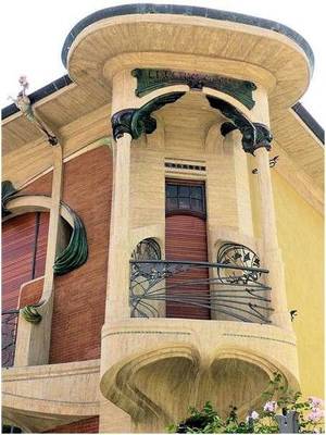Cladding with arcs on house facade