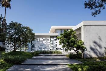 Mosaic Facade: Contemporary Mansion with Geometric Panel Solution