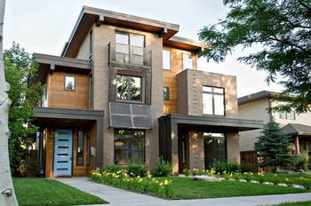 Contemporary Facade with Contrasting Brick and Wood Combination