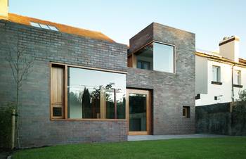 Brick Minimalism: Contemporary Facade with Contrasting Play of Volumes and Materials