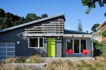 Modern Gray Facade with Green Door and Asymmetrical Lattice