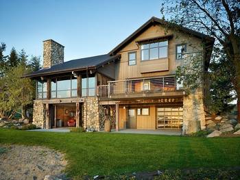 Modern Rustic Facade: Harmony of Stone and Wood Against a Natural Backdrop