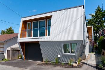 Dynamic Metal Facade: Contemporary House with Angular Planes