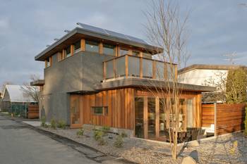 Eco-House with Contrasting Facade: Concrete and Wood Harmony