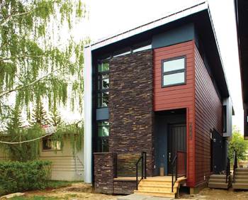 Contemporary urban house with contrasting stone and wood façade