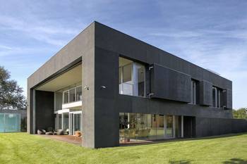 Monolithic Minimalism: Graphite Façade with Volumetric Play