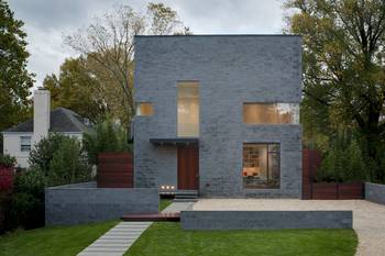 Monolithic Gray Facade: Interplay of Contrasts and Geometry in Contemporary Minimalism