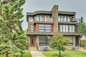 Modern Duplex with Combined Facade: Stone, Wood, and Glass in Three-Level Architecture