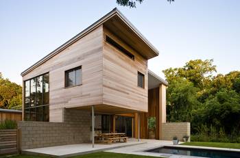 Modern wooden facade with contrasting concrete base