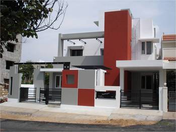 Modern Geometric Facade with Red Accents: A Modular Approach to Residential Architecture