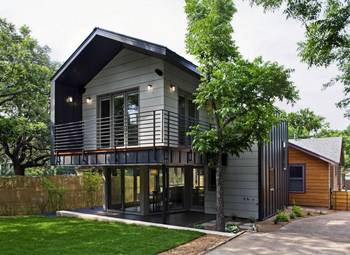 Cladding with balcony on house facade