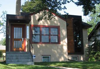 Compact Modernist Facade with Contrasting Wooden Accents