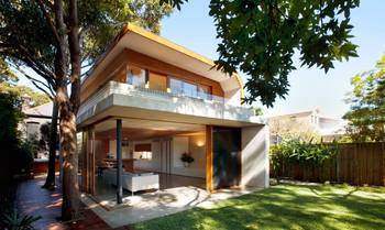 Modern Facade with Contrasting Wood and Concrete Combination