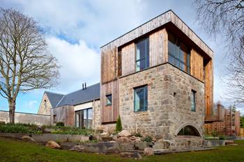 Harmonious Contrast: Modern Facade with Stone and Wood Combination