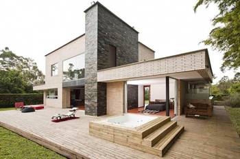 Modern country house with a contrasting stone and brick facade