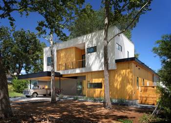 Modern Two-Level Façade with Contrasting Combination of Wood and White Surfaces