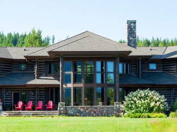 Majestic Log Facade with Panoramic Glazing