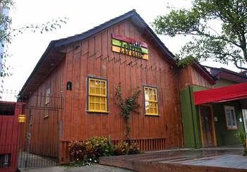 Wooden Caribbean-style facade with vibrant contrasting elements