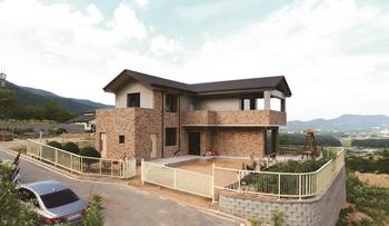 Mountain residence with combined brick-stucco facade and panoramic viewing terraces