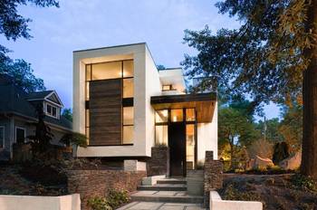 Contemporary minimalist facade with contrasting combination of white plaster, wood, and stone