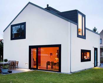 Minimalist white facade with contrasting black windows