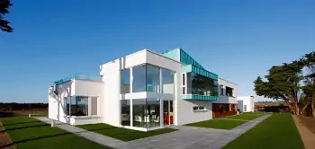 White minimalist facade with contrasting glass elements