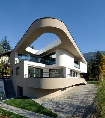 Cladding with arcs on house facade
