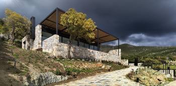 Cladding of rough stone country house