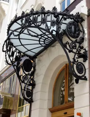 Wrought Iron Lace Canopy: An Elegant Accent of a Historical Facade