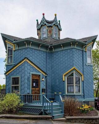 Photo of house with dark blue parts
