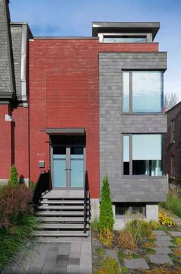 Dualistic Facade: Modern Urban House with Contrasting Brick and Gray Cladding