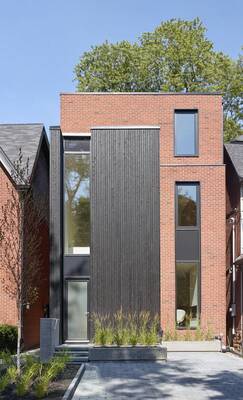 Modern Urban Facade with Contrasting Brick and Wood Combination