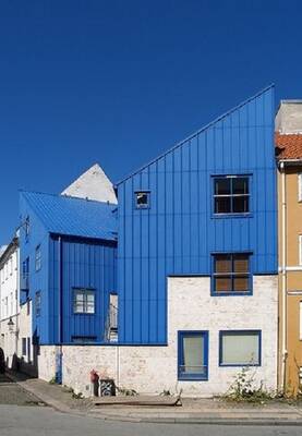 Dynamic Blue Façade: Contrasting Geometry in an Urban Landscape