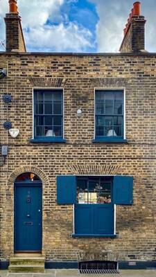 Traditional Brick Facade with Blue Accents