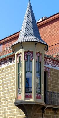 Decorative Bay Window with Spire Roof: An Elegant Detail of a Historical Façade